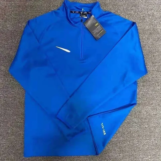 Haut running Nike demi-zip
