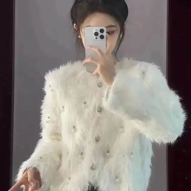 Veste fausse fourrure perlée