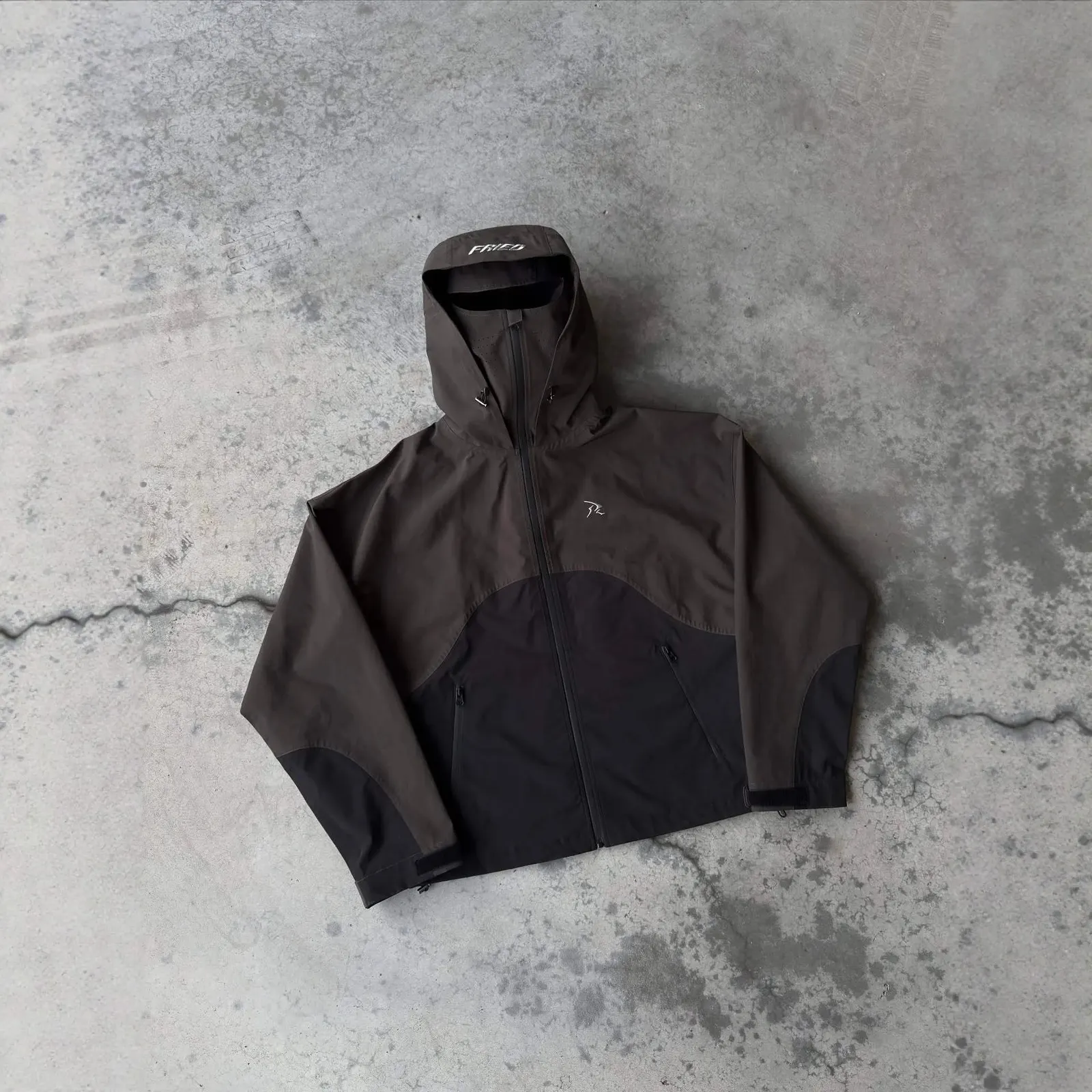 Veste coquille à capuche
